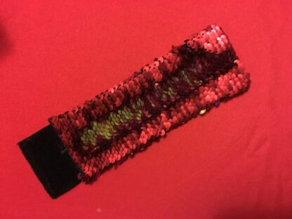 Mermaid bracelet with sequins that change from the touch, from red to gold and back again.